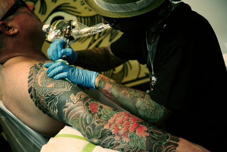 Modern style tattooist at work