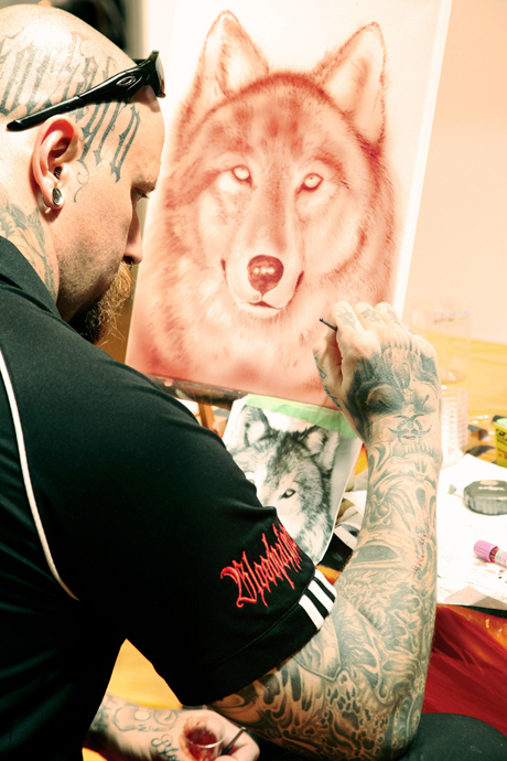 That's blood he's painting with!